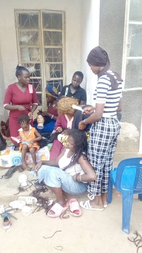 Children receiving donated school supplies in Kampala